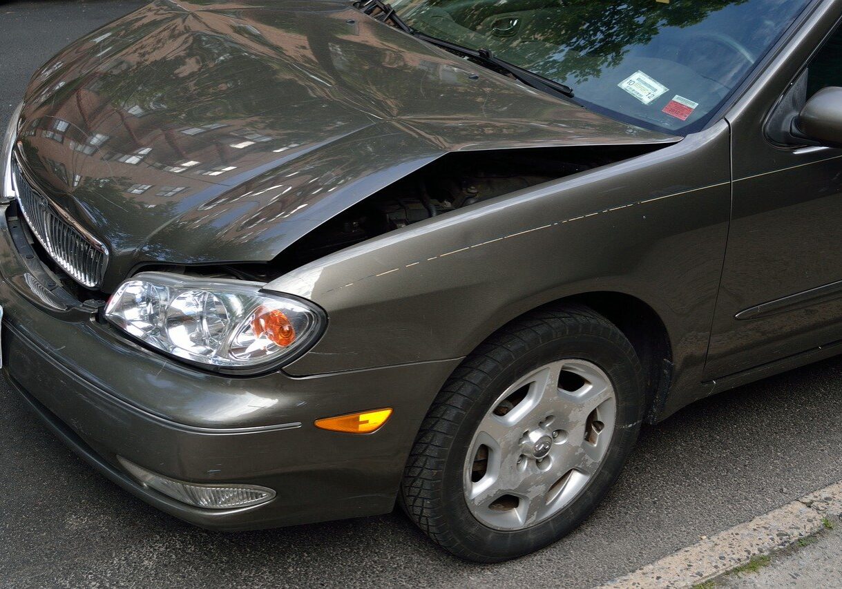 close-up of a car with a damaged hood