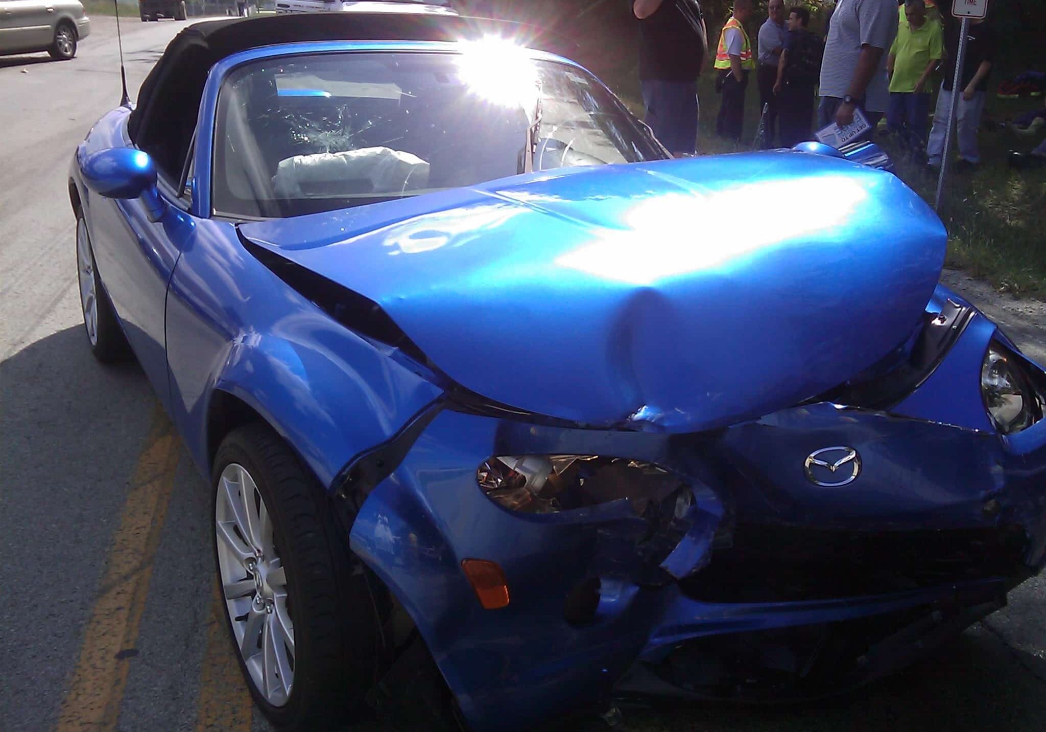 damaged blue car