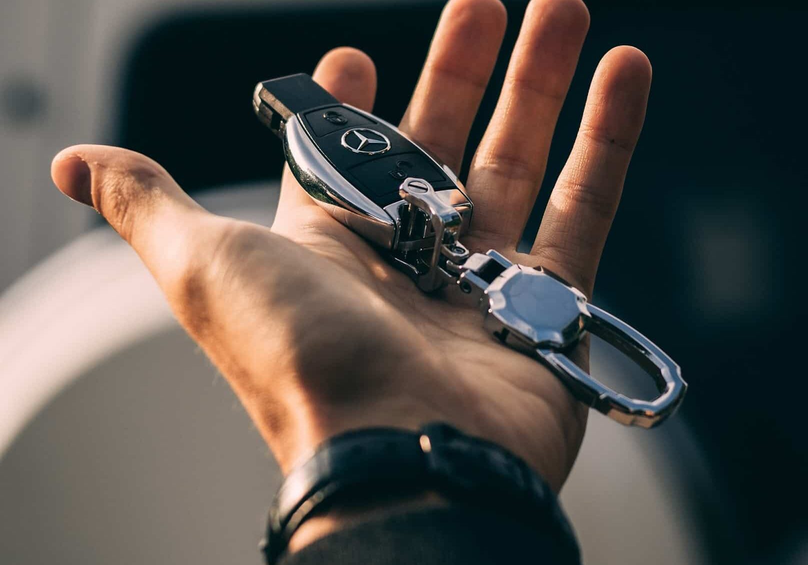 holding a car key