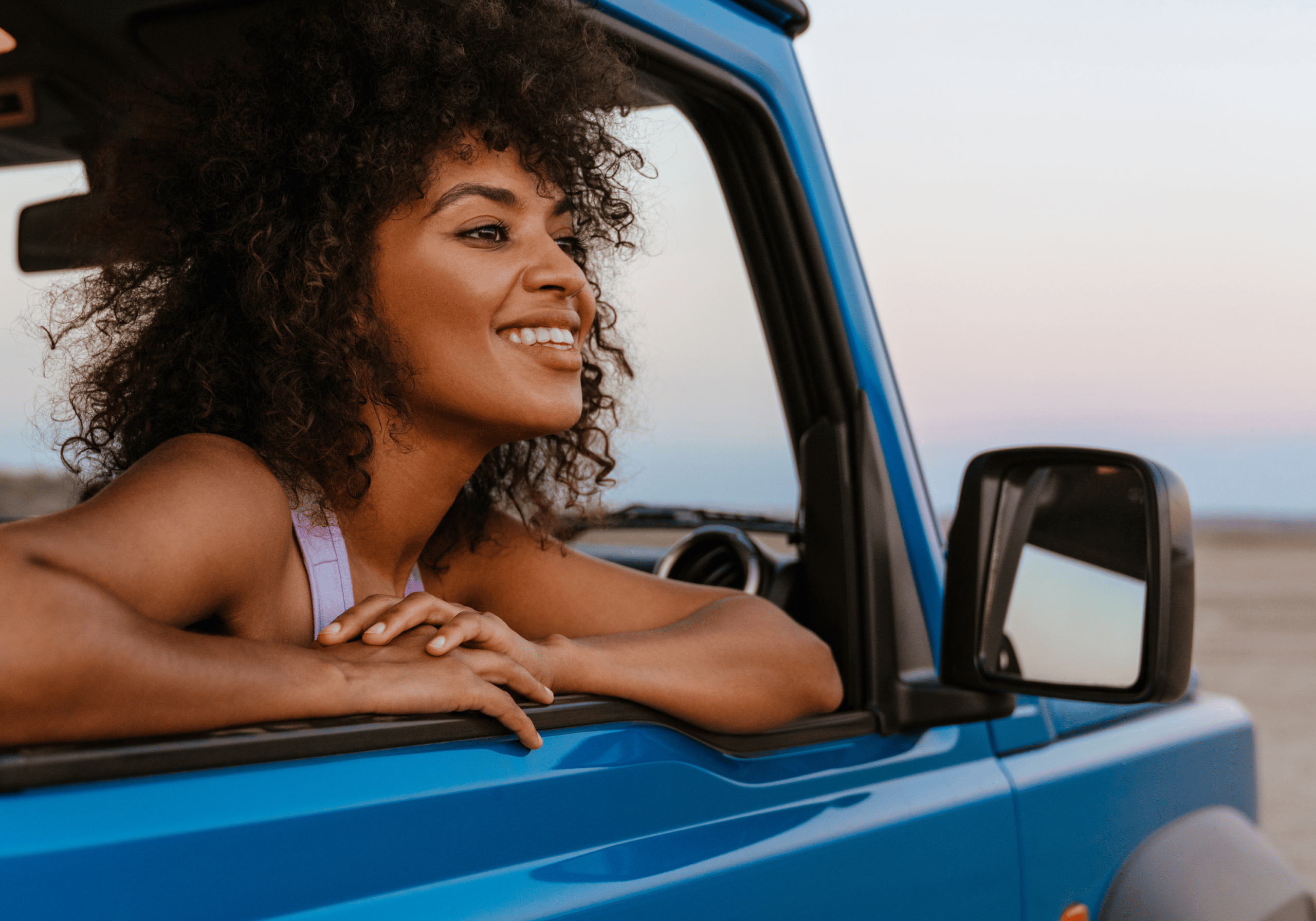 woman looking out the passenger seat window