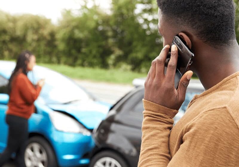 man calling after a car crash accident