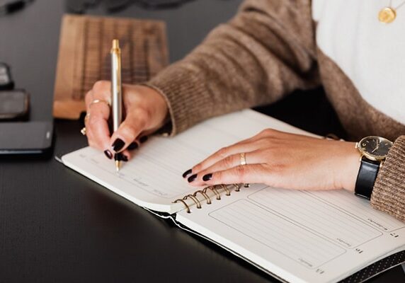 woman writing a journal