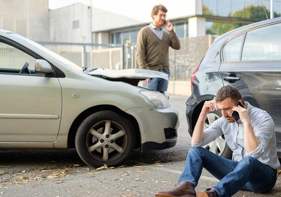 two man calling after a car crash accident