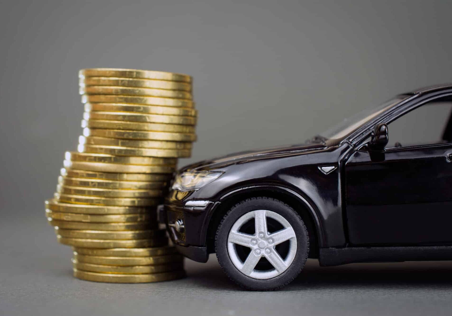 toy car crashing to a pile of coins