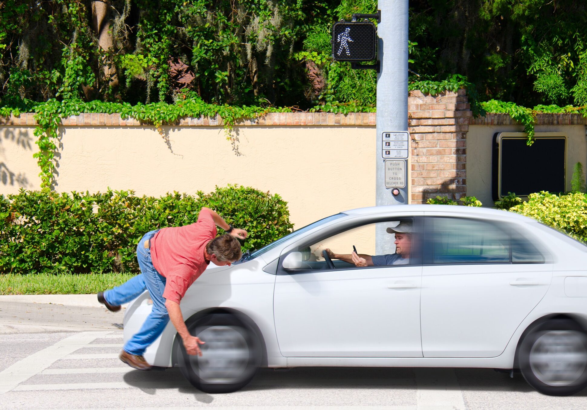 driver texting hits a pedestrian with the cross now sign visible