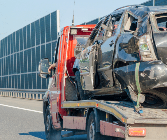 car on tow truck after accident