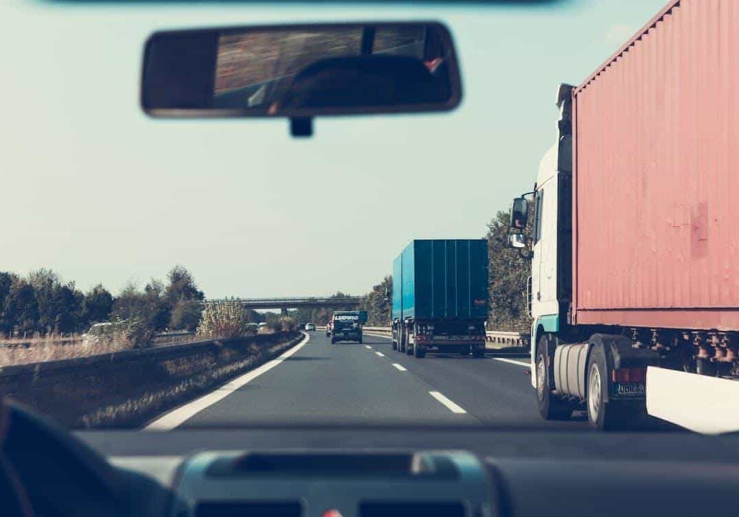 Free Blue and Red Freight Truck on Road Stock Photo